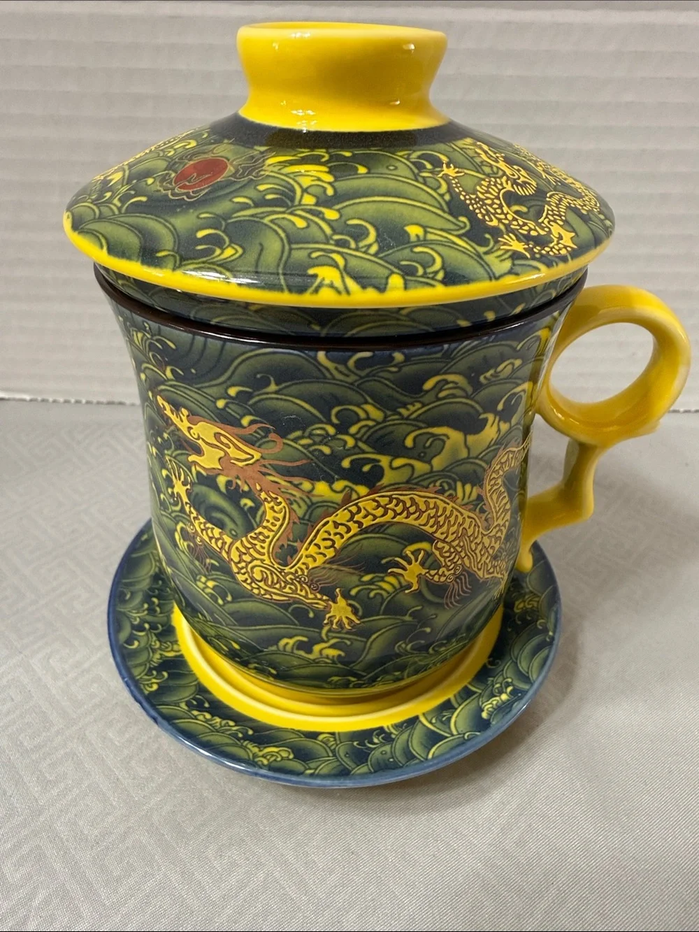 Porcelain Tea Cup Set Lid Saucer and Infuser Chinese Dragon Motif Yellow & Green